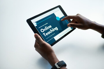 Go the distance, get that degree. Cropped shot of a man using a digital tablet to have an online lesson.