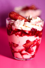 Colorful and creamy - delicious fruit and berries tiramisu cake in glass