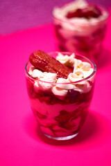 Colorful and creamy - delicious fruit and berries tiramisu cake in glass