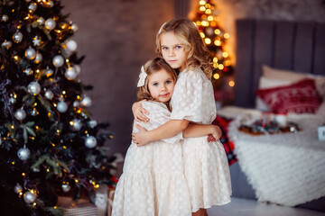children, new year, new year's interior, christmas tree, photo shoot in the studio, family, sisters