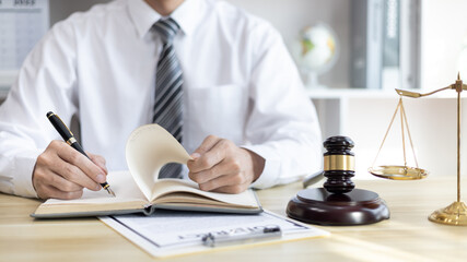 Lawyers or judges sign documents in accordance with legal and fair terms of agreement, Legal Ethics and Integrity, scales of justice, law hammer, Litigation and legal services.