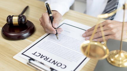 Lawyers or judges sign documents in accordance with legal and fair terms of agreement, Legal Ethics...