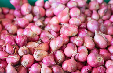 Shallot put together as a group in basket basket at the market, Fresh red onions background, shallots fresh purple in basket, Shallots close up ,Vegetables for health Shallots is herbal.
