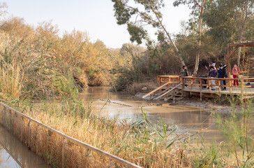 View from the Israeli side of the Israeli-Jordanian border, passing along the Jordan River, in the...