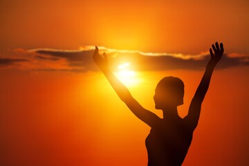 Young woman looking up feeling energized by the warm rays and sky