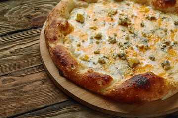 Italian Pizza Quattro formaggi. Italian pizza on dark stone background