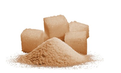Pile of brown granulated sugar and sugar cubes on the desk