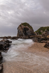 Cloudy view around the rocky coastline.