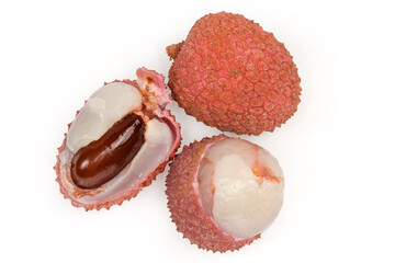 Partly peeled, whole and half of the ripe lychee fruits