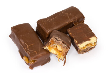 Chocolate candies with nougat and nuts filling on white background