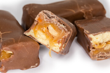 Chocolate candies with nougat and nuts filling close-up