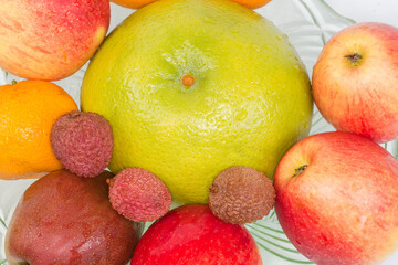 Top view of different fruits in the glass bowl