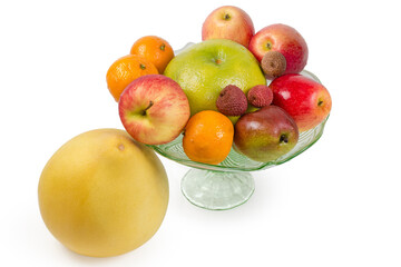 Different fruits in vintage glass bowl and pomelo fruit