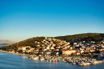 Fototapeta premium View at town Trogir, old touristic place in Croatia Europe Trogir town coastal view. Magnificent Trogir, Croatia. Sunny old Venetian town, Dalmatian Coast in Croatia.