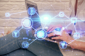 Double exposure of woman hands typing on computer and social network theme hologram drawing. People media concept.
