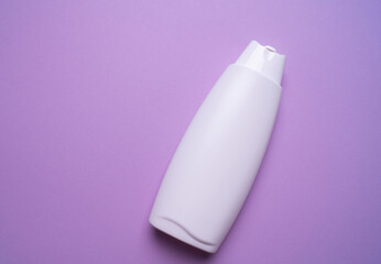 shampoo or hair conditioner bottle on blue background