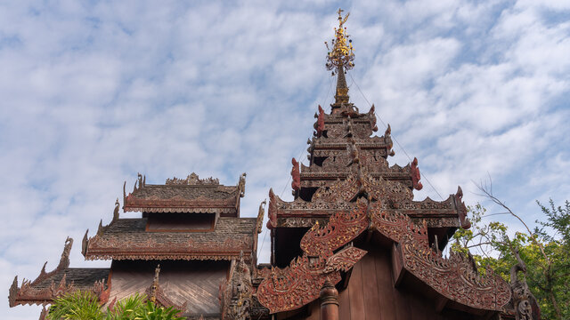 Low angle view of beautiful traditional Shan religious wooden roof architecture at historic Wat Pa Pao buddhist temple, Chiang  Mai, Thailand