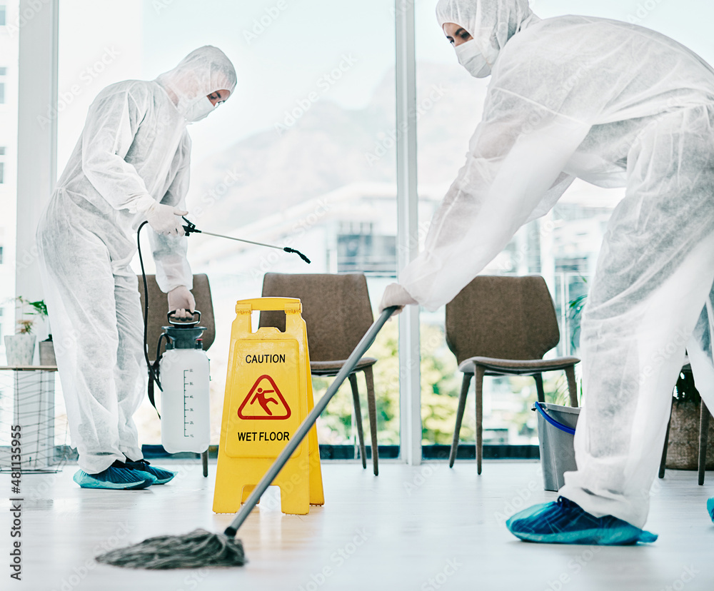 Poster control corona and keep it clean. shot of healthcare workers wearing hazmat suits and sanitising a r