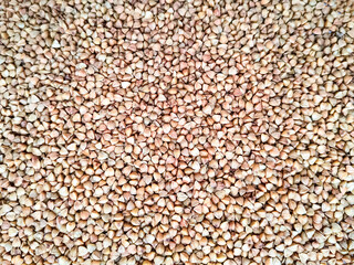 Fried buckwheat background - raw healthy diet food