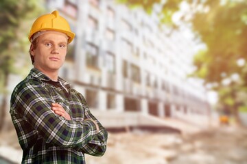 Male engineer handsome man or architect looking construction with safety helmet