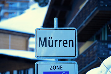 Road signs at mountain village Mürren in the Swiss alps on a sunny winter day. Photo taken Januar 15th, 2022, Lauterbrunnen, Switzerland.