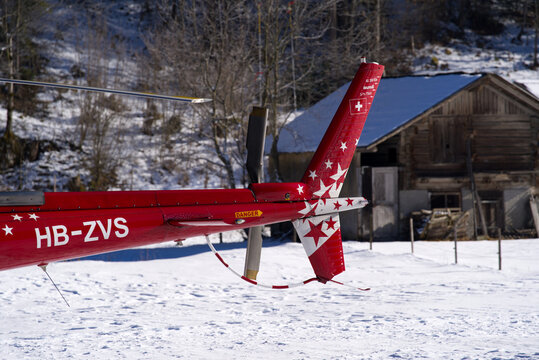 Close-up of helicopter type Eurocopter AS350 B3 Ecureuil register HB-ZVS at heliport of Air Glaciers at Mountain Village Lauterbrunnen. Photo taken January 15th, 2022, Lauterbrunnen, Switzerland.