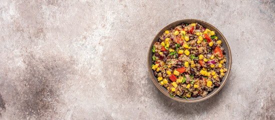 Mexican black bean and quinoa salad. Brown rustic background. Top view, banner.