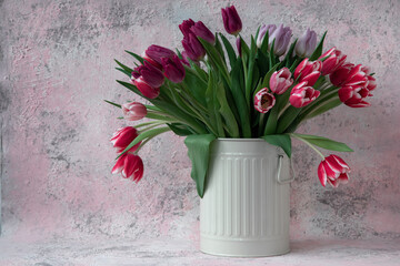Bouquet of tulips in a white vase 