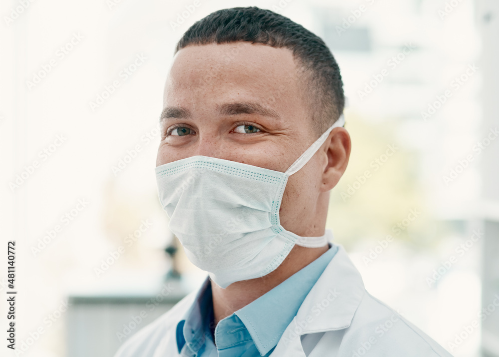 Poster safety comes first in our lab. portrait of a confident young scientist wearing a mask in a modern la
