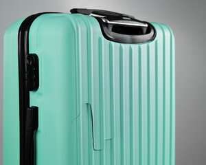 Close-up of a broken suitcase on a white background. Damaged baggage during the flight.