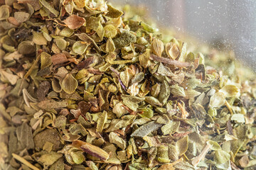 Close-up shot of dried thyme in a glass jar