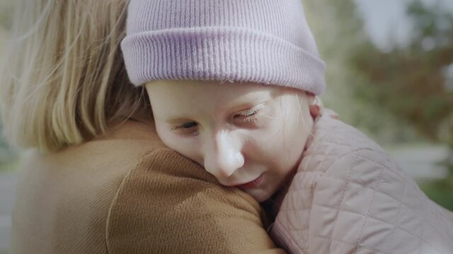 The mother tries to rest the crying baby.