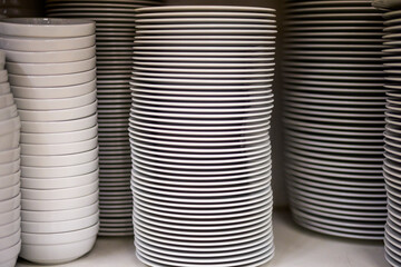 a stack of plates in a restaurant kitchen