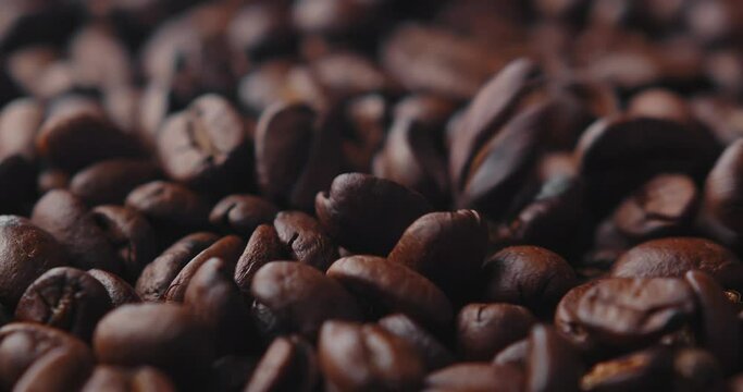 coffee beans close-up cinematic view, macro shot of coffee beans. roasted coffee beans in slow motion.