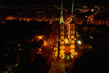 Aerial view of night Wroclaw cityscape panorama in Poland. Cathedral of St. John on Tumski island, bird eye view