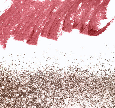 Pink lipsticks smears, gold glitter, abstract background with cosmetics