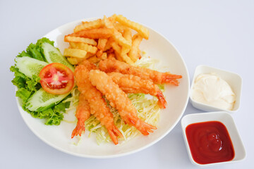 Shrimp tempura with fries isolated on white background.