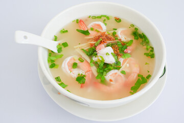 ฺBowl hot shrimps porridge isolated on white background.