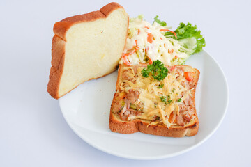 Tuna melt with bread isolated on white background.