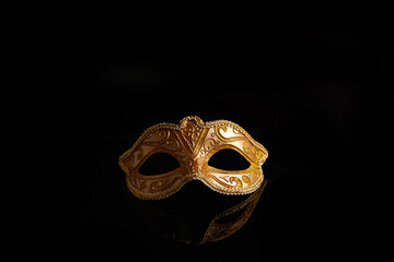 Luxury venetian mask on dark glitter background. Carnival masquerade fantasy mask