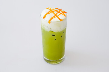 Iced green tea with whip cream on white background.