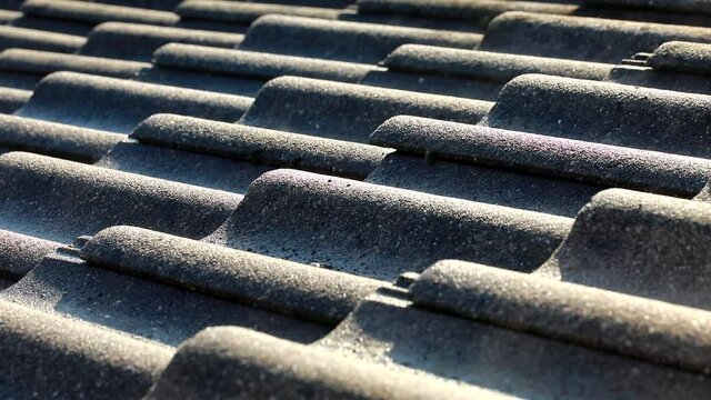 Water vapor- Motion condense on the roof at the first warm morning sun during winter day