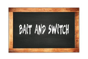 Fototapeta premium BAIT AND SWITCH text written on wooden frame school blackboard.