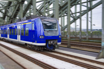 S-Bahn regional suburban train S Bahn at bridge in Cologne, Germany.