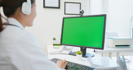 doctor use computer with headset