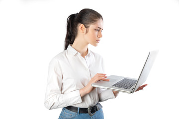 Naklejka premium Business woman using a laptop wearing a white shirt. Isolated on white background. 20-22 years old. White european woman.