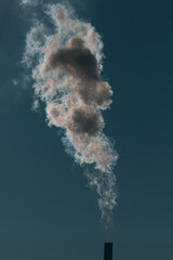 Smoke coming out of factory chimney.