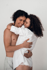 happy heterosexual couple man and woman embracing white background