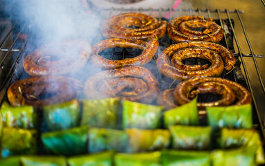 Sausages grilled in a charcoal oven, a local food of northern Thailand.