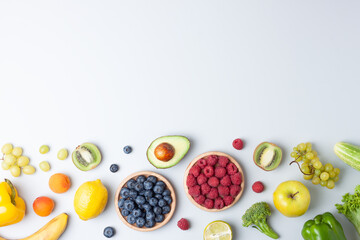 Fresh fruits and vegetables on grey background. Healthy eating concept. Flat lay, copy space.